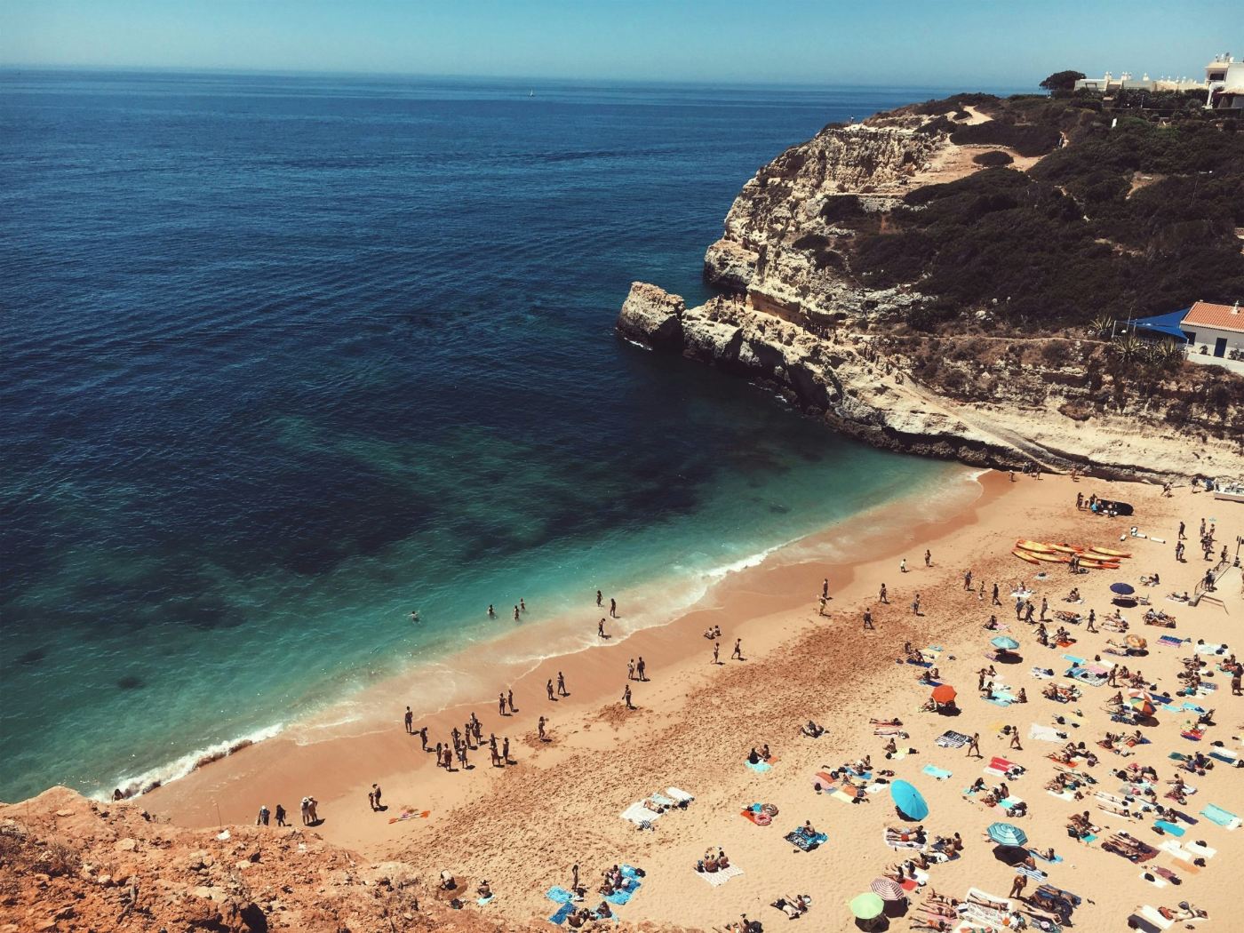 Busy beach with clear water